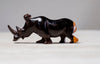 A BEAUTIFULLY HAND CARVED RHINO FROM EBONY WOOD